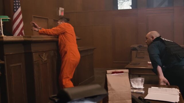 Inmate pushing cop in court room brawl to try and escape justice