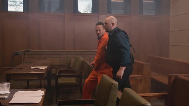 Inmate pushing cop in court room brawl to try and escape justice