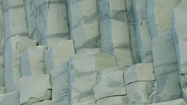 Close up view of natural basalt stone columns texture at Reynisfjara beach in Iceland