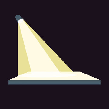 Spotlight shines down on an empty stage from above