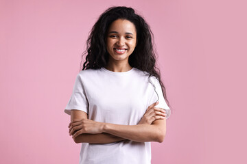 Fototapeta premium Portrait of beautiful young woman on pink background
