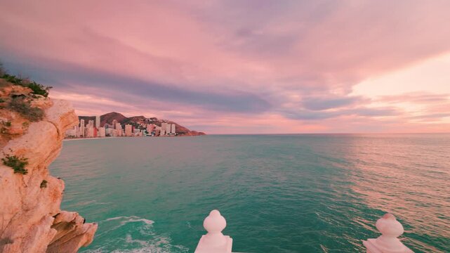 Scenic balcony of the mediterranean overlooking benidorm at sunset