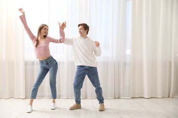 Fototapeta premium Date. Lovely couple dancing together at home, space for text