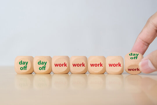 Wooden blocks showing four day work week concept with day off and work schedule. Modern workplace policy, reduced working hours and productivity balance strategy.