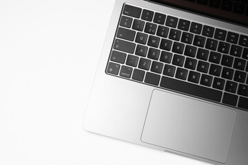 Laptop on white background, top view. Space for text