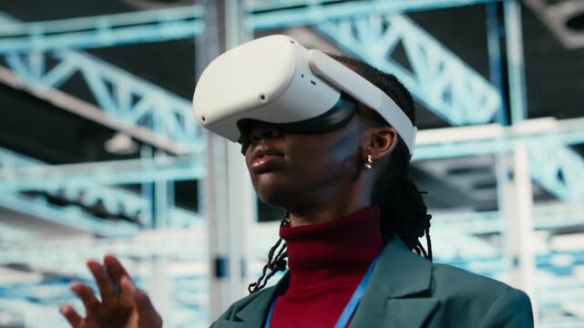 Data center female engineer putting VR glasses on to do gear rigs optimization. African american woman in server room using virtual reality and pinch zoom hand gestures to upgrade mainframes, camera B
