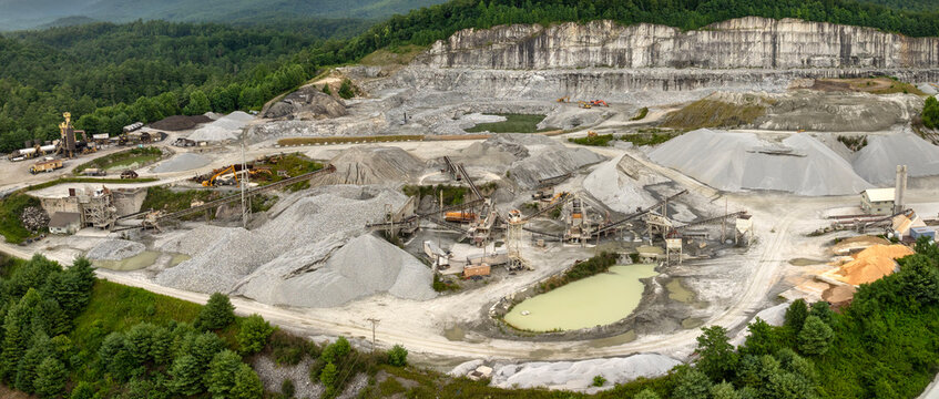 Sand open-pit mining quarry with processing plant for crushed stone. Extracting of natural resources for construction industry