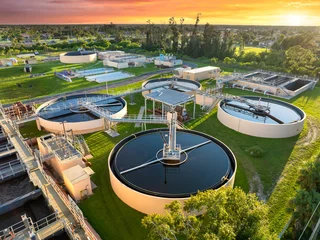 Selbstklebende Fototapeten Altes Krankenhaus Beelitz Water treatment facility with multiple tanks and filtration units. Vital infrastructure for sustainable water management and distribution  © bilanol