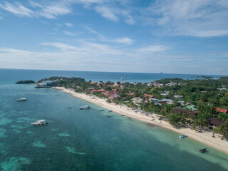 Obraz premium Aerial view of Malapascua Island with banca boats and sandy coastline, Philippines