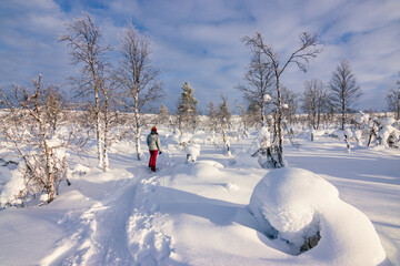 Hiking to the summit of Mount Kiilopää during a spectacular arctic sunset in Finnish Lapland. © julen