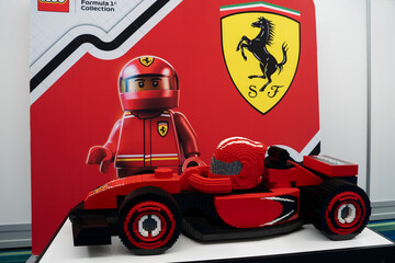 Fototapeta premium LEGO Ferrari Formula style race car model with driver figure display. Toronto, Canada - February 18, 2026.