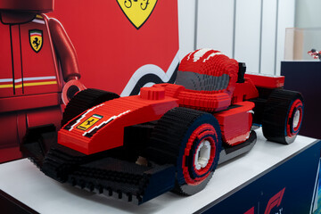 Fototapeta premium LEGO Ferrari Formula style race car model with driver figure display. Toronto, Canada - February 18, 2026.