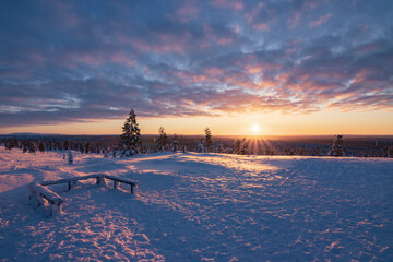 Hiking to the summit of Mount Kiilopää during a spectacular arctic sunset in Finnish Lapland. © julen