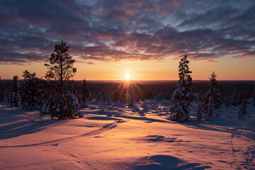 Hiking to the summit of Mount Kiilopää during a spectacular arctic sunset in Finnish Lapland. © julen