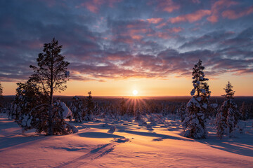 Hiking to the summit of Mount Kiilopää during a spectacular arctic sunset in Finnish Lapland. © julen