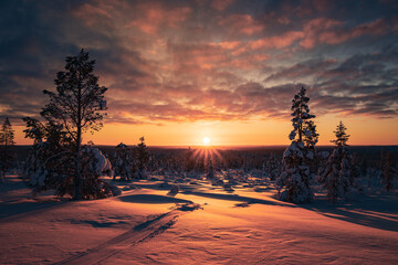 Hiking to the summit of Mount Kiilopää during a spectacular arctic sunset in Finnish Lapland. © julen