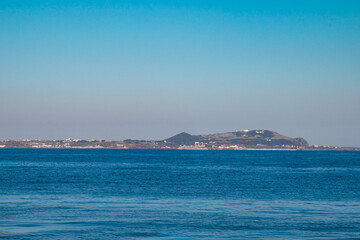 Fototapeta premium Udo Island viewed from Seongsan coast in Jeju, South Korea