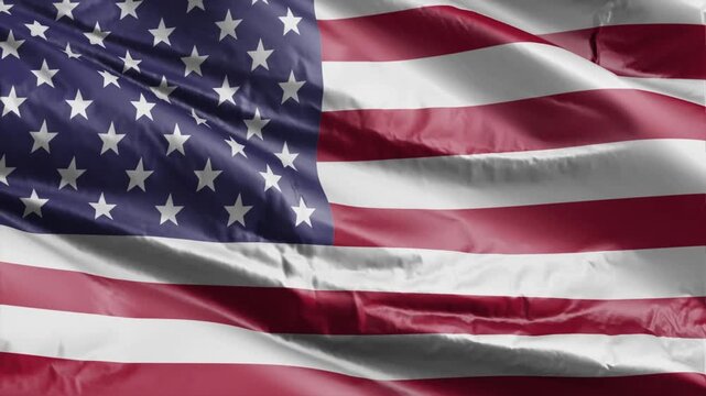 Waving American flag, USA stars and stripes fluttering in the wind, symbolizing patriotism and freedom, commercial use 4K stock footage perfect for video editing and background