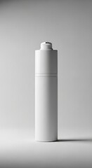 A white bottle stands upright on a surface, viewed from the side in a studio setting with soft lighting.