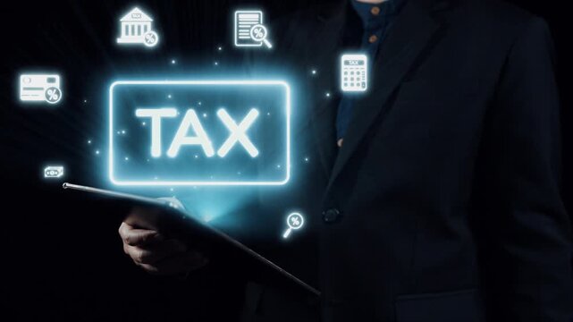 A businessman stands with a tablet displaying various tax-related icons and graphics, highlighting the significance of finance and data management in modern business strategies. Qubit