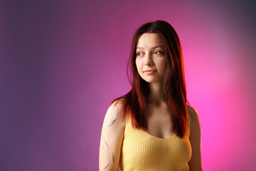 Fototapeta premium Woman with dyed hair on color gradient background, space for text
