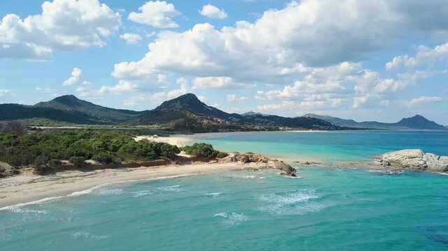 Aerial view of serene beach with turquoise water and mountains
