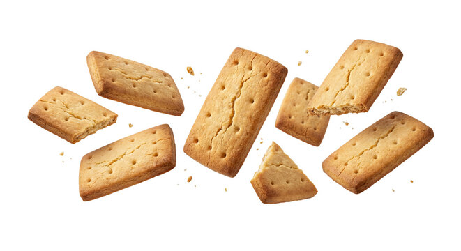 Levitating golden butter biscuits with crumbs isolated on white background