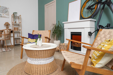 Fototapeta premium Interior of living room with bicycle, fireplace and armchairs