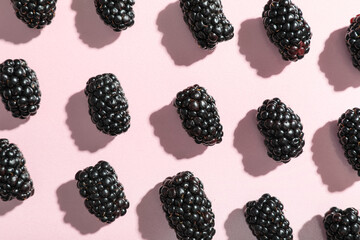 Fresh ripe blackberry on pink background, closeup © Pixel-Shot