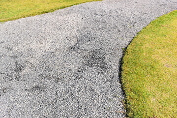 stone path and green grass in the garden