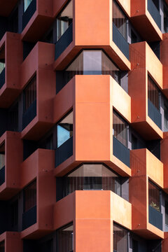 Abstract architecture detail of modern apartments building facade showing balconies windows and urban geometry pattern with bold structure