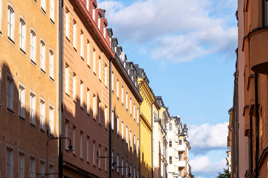 Strong perspective shapes historic urban architecture along a narrow street with Sodermalm facade in Stockholm Sweden and Scandinavia building lines