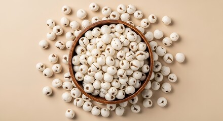 Authentic popped lotus seeds in a dark wood bowl, perfect for healthy snacking and traditional Indian recipes.