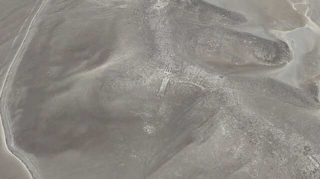 4K aerial cinematic shot of Atacama Giant geoglyph on Cerro Unitas. Ancient archaeological anthropomorphic figure in Chile.