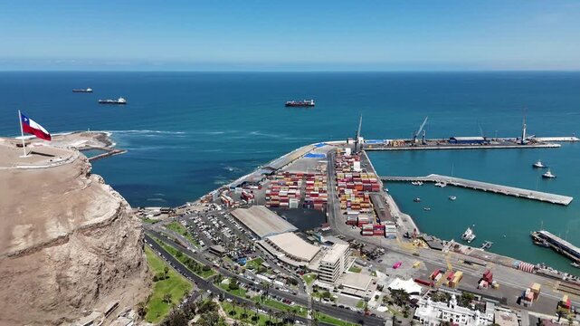Aerial 4K view of Morro de Arica, sunny day over the Pacific Ocean coast and historical landmark. Chile