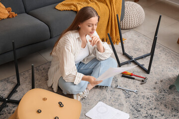 Beautiful young woman with manual assembling furniture at home