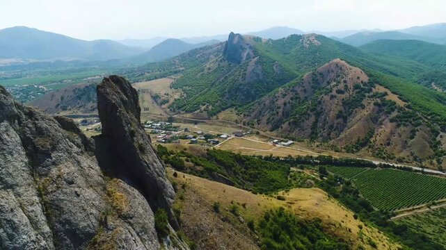 Aerial view of rocky mountains and green valleys