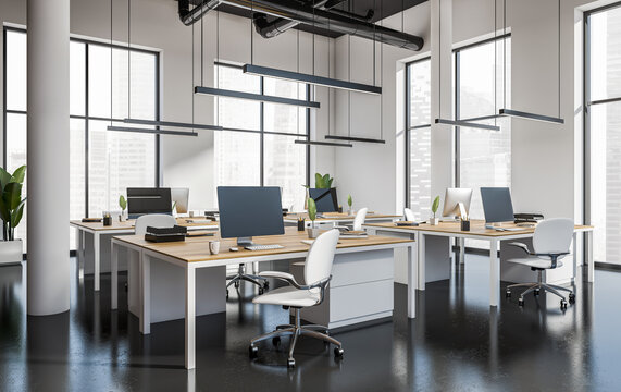 Open modern office interior with multiple desks and computers in clean bright style on a light background, concept of workspace efficiency, 3D Rendering