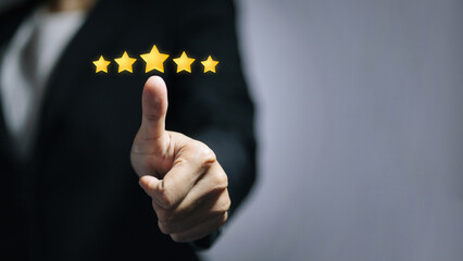 Five Star Rating and Customer Satisfaction Concept with Thumbs Up Gesture