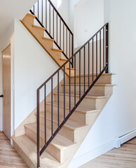 Modern Wooden Staircase with Metal Railing in Bright Minimal Interior