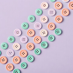 Fototapeta premium A dreamy flat lay of pastel painted buttons scattered on a purple background pastel buttons colorful buttons