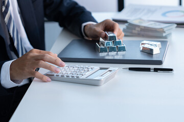 Fototapeta premium Businessman calcultor silver price silver trading concept