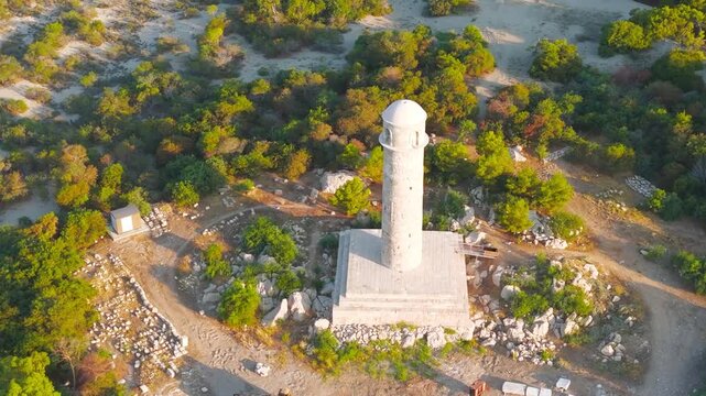 Gelemis, Turkey. Architectural details of Patara Roman lighthouse, ancient stonework with sea and beach in morning light. Aerial View, MasterShots, Zoom In, Circle (Close)