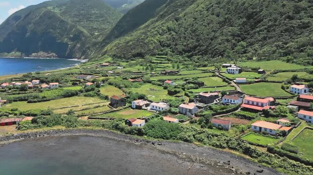 Aerial view of lush hills and coast in Caldeira do Santo Cristo, Azores