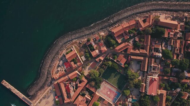 Aerial view of Gor&eacute;e Island, a UNESCO World Heritage site, is magical during the day with a magical sunset