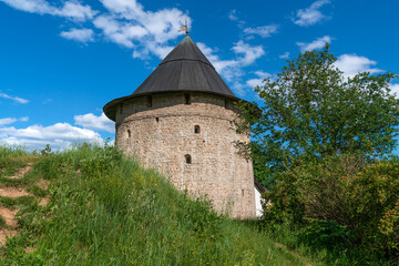 Obraz premium Tailovskaya Tower of the Holy Dormition Pskov-Pechersk Monastery on a sunny summer day, Pechory, Pskov region, Russia