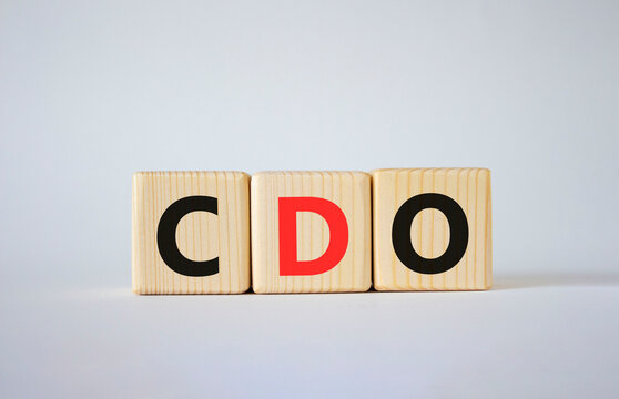 CDO - Collateralized Debt Obligation symbol. Wooden cubes with word CDO. Beautiful white background. Business and Collateralized Debt Obligation concept. Copy space.