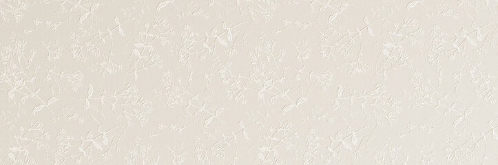 A subtle white embossed floral pattern with delicate leaves and blossoms creating an elegant textured wallpaper background.
