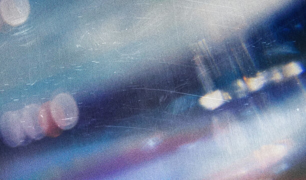 Dust scratches overlay. Old film effect. Blue distressed faded glass with smeared dirt stains colorful rainbow lens flare design. sun light abstract background texture