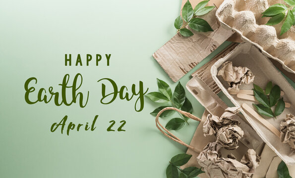 World environment Day, go green, recycle, earth day and eco concept, Different paper garbage materials and plant on pastel background.